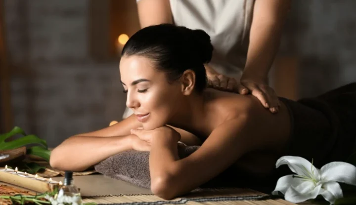 How to use hotel gift card solutions to increase revenue - A woman gets a massage at a hotel - Hospitality Solutions