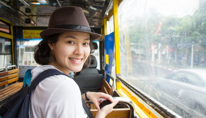 asian woman on bus travelling