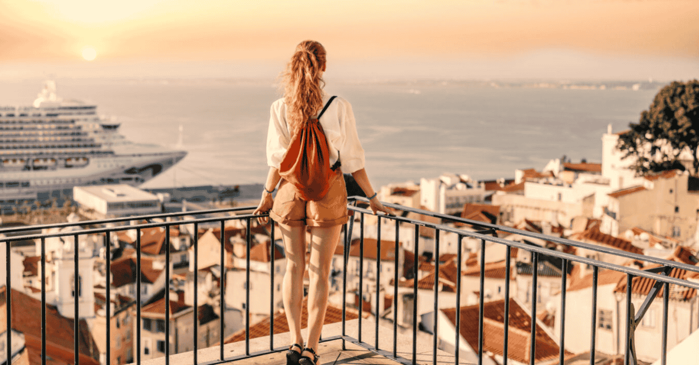 Creative ways hotels are using gift cards in 2025 - A woman stands over a lookout facing the ocean in Europe - Hospitality Solutions